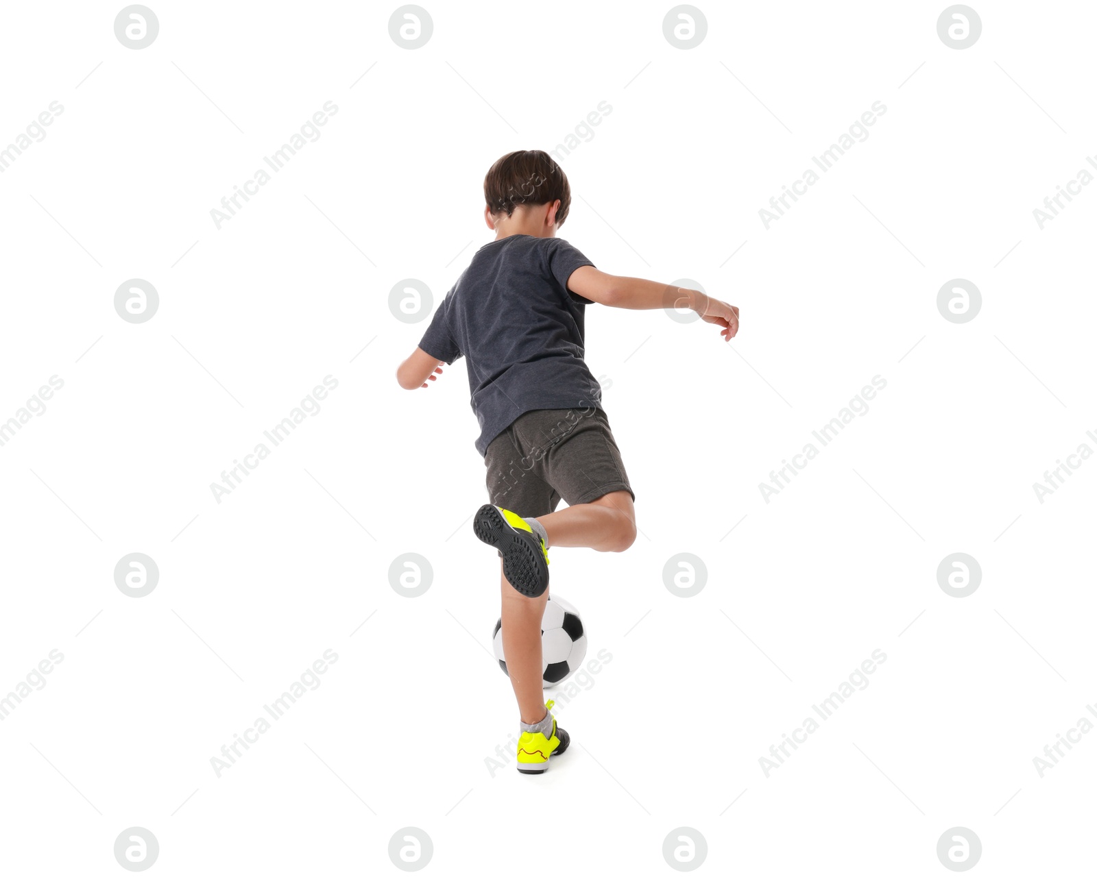 Photo of Boy with soccer ball playing football on white background, back view