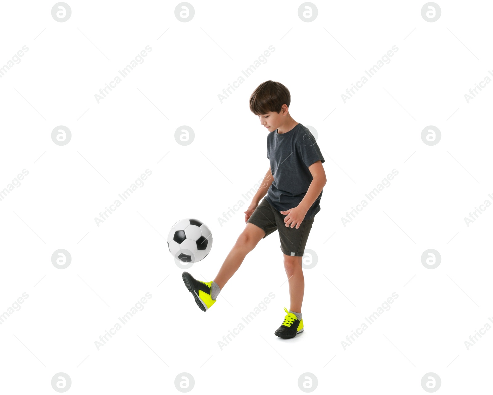 Photo of Boy with soccer ball playing football on white background