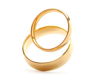 Beautiful golden wedding rings isolated on white