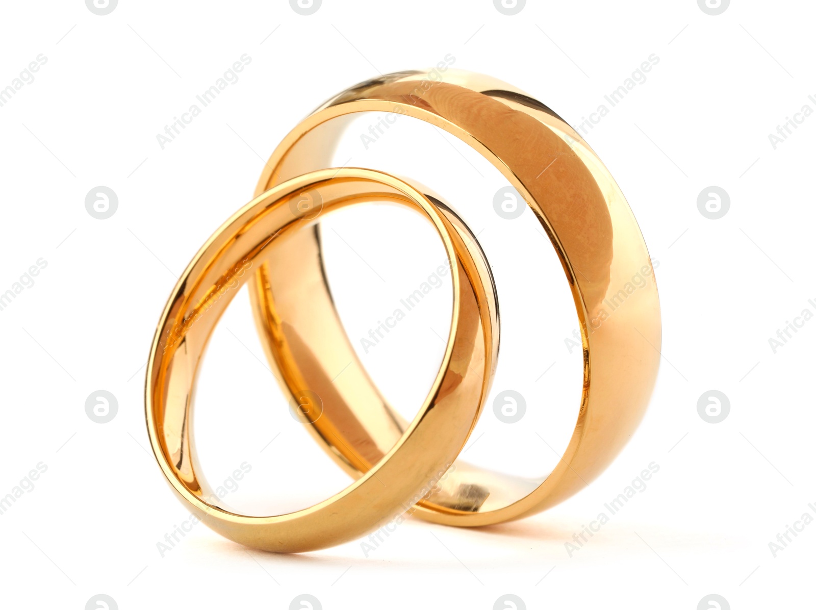 Photo of Beautiful golden wedding rings isolated on white