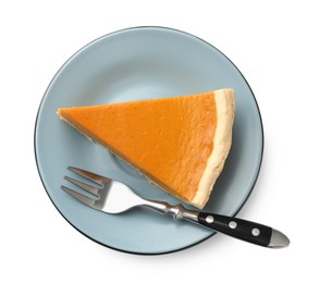 Photo of Piece of tasty homemade pumpkin pie and fork isolated on white, top view