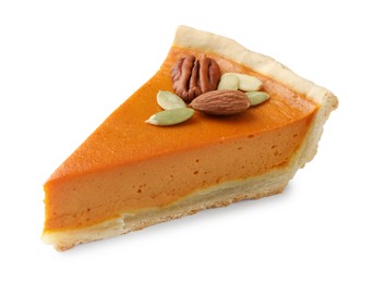 Piece of tasty homemade pumpkin pie with seeds and nuts isolated on white