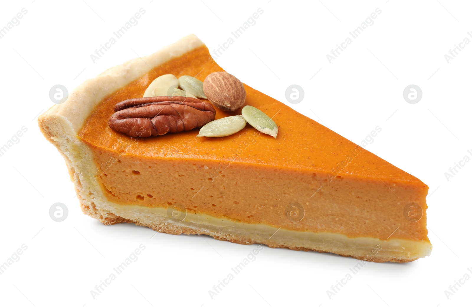 Photo of Piece of tasty homemade pumpkin pie with seeds and nuts isolated on white