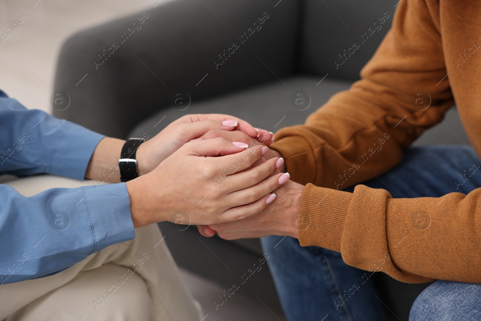 Photo of Professional psychologist working with patient in office, closeup