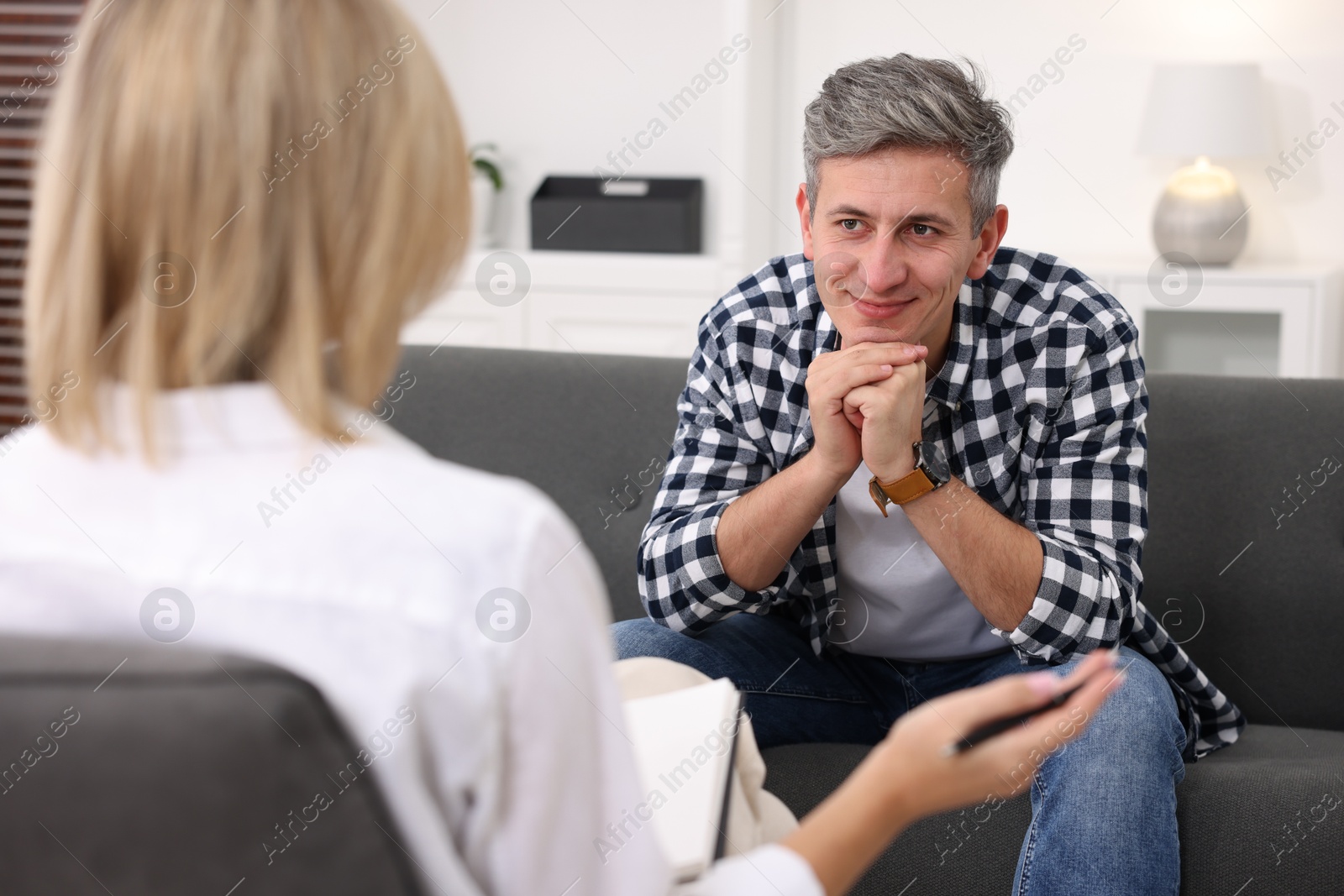 Photo of Professional psychologist working with patient in office