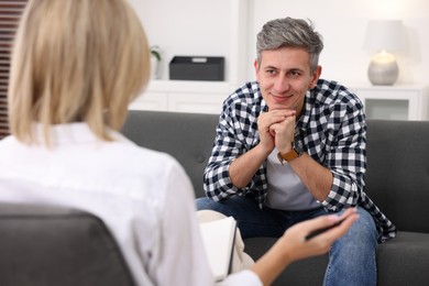 Photo of Professional psychologist working with patient in office