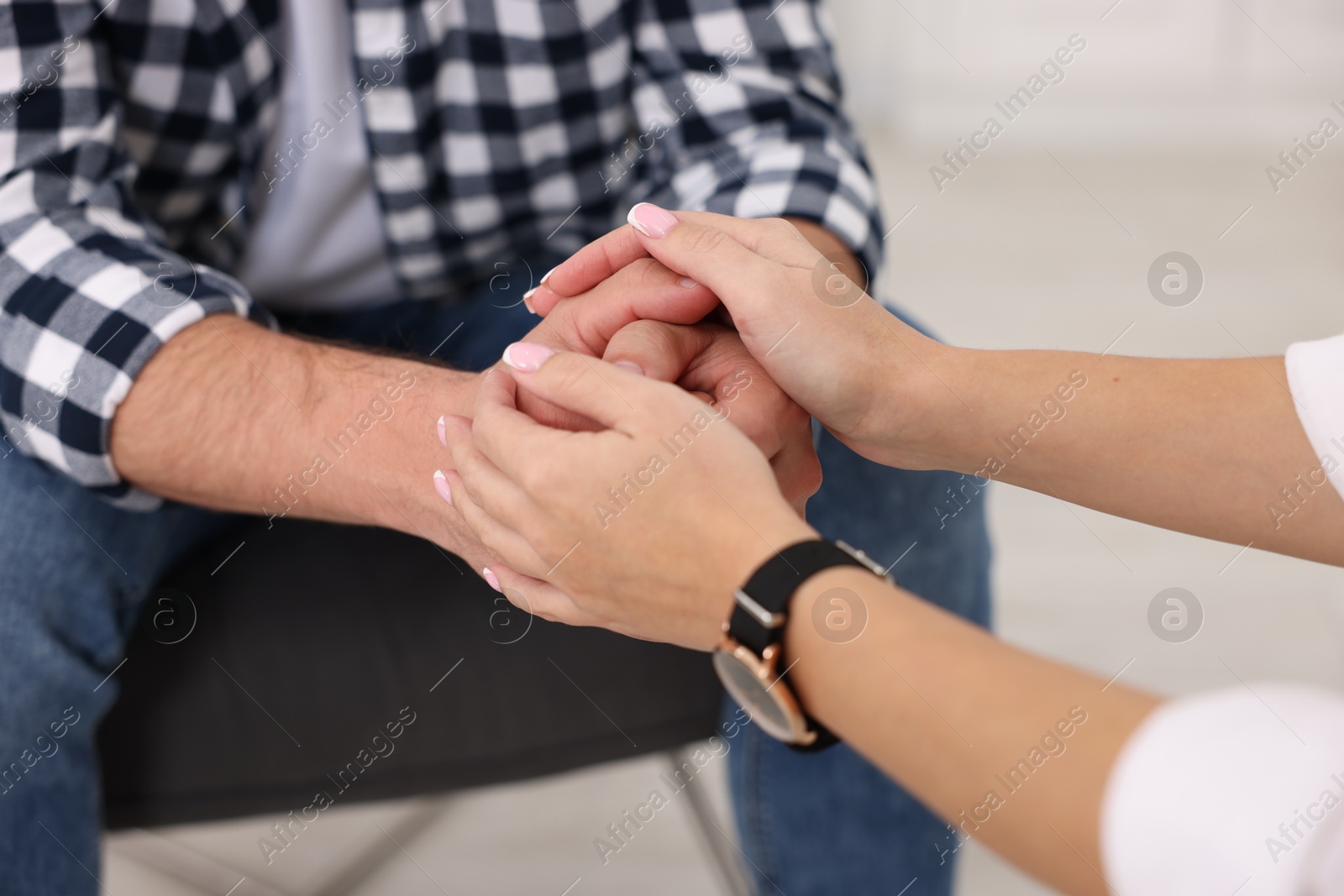 Photo of Professional psychologist working with patient in office, closeup