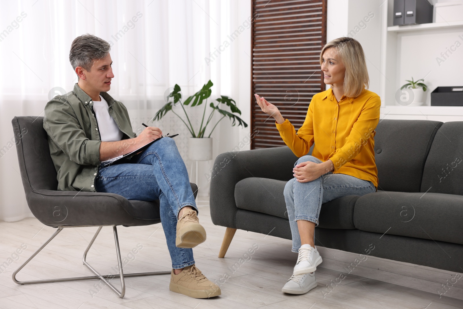 Photo of Professional psychologist working with patient in office