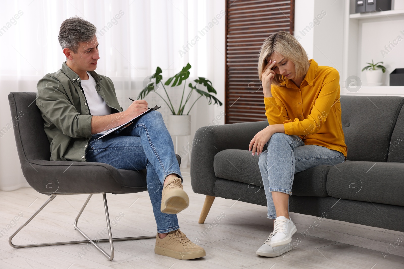 Photo of Professional psychologist working with patient in office