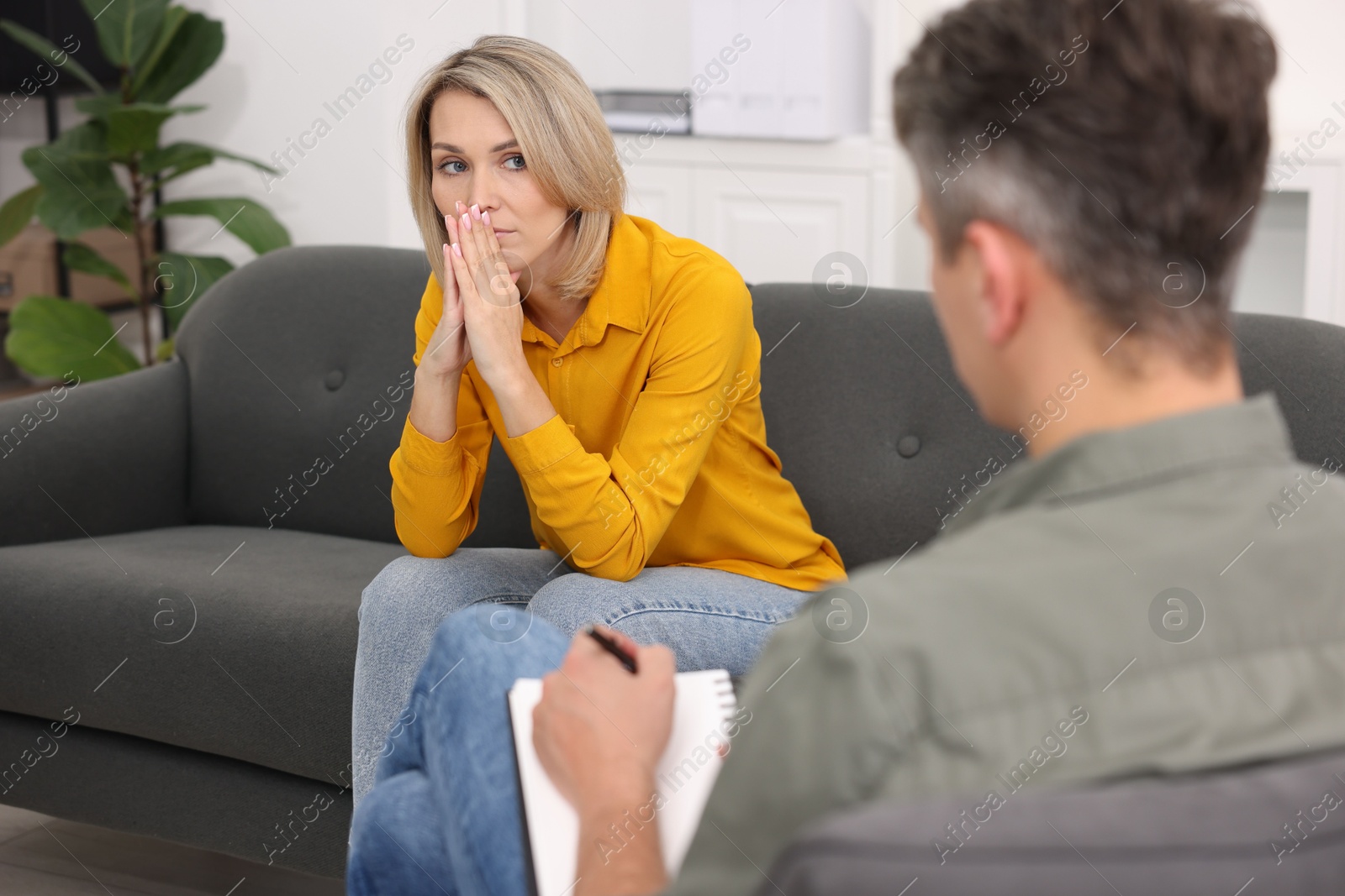 Photo of Professional psychologist working with patient in office