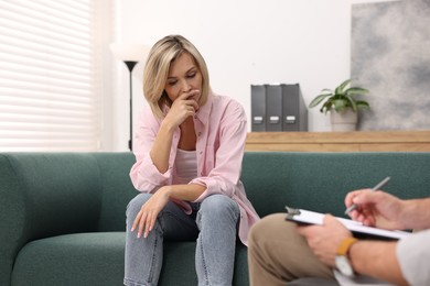 Photo of Professional psychologist working with patient in office, closeup