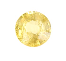 Photo of One shiny yellow gemstone isolated on white, top view