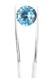 Photo of Tweezers with shiny light blue gemstone isolated on white