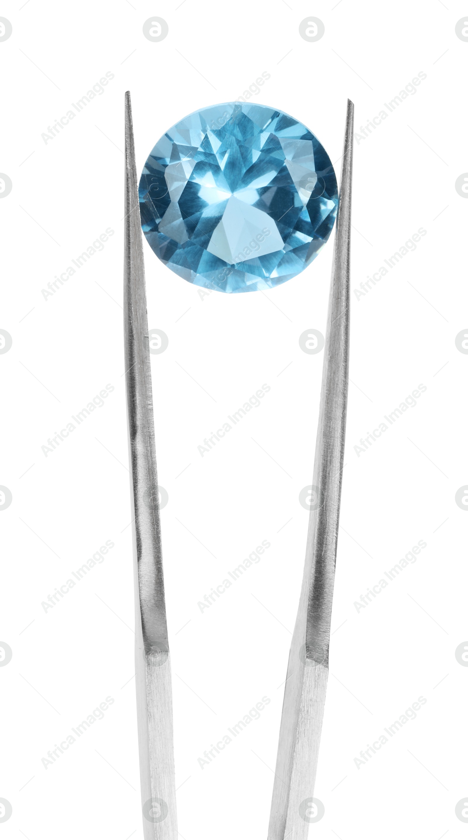 Photo of Tweezers with shiny light blue gemstone isolated on white