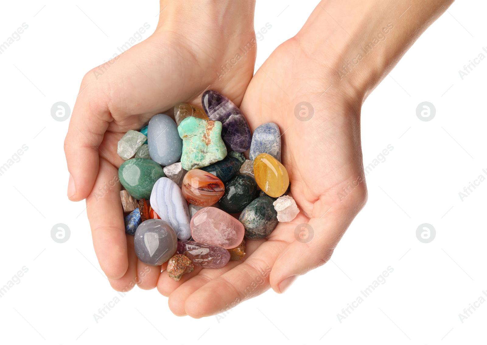 Photo of Woman holding different natural mineral stones on white background, closeup