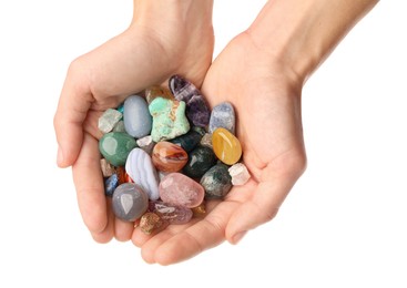 Photo of Woman holding different natural mineral stones on white background, closeup