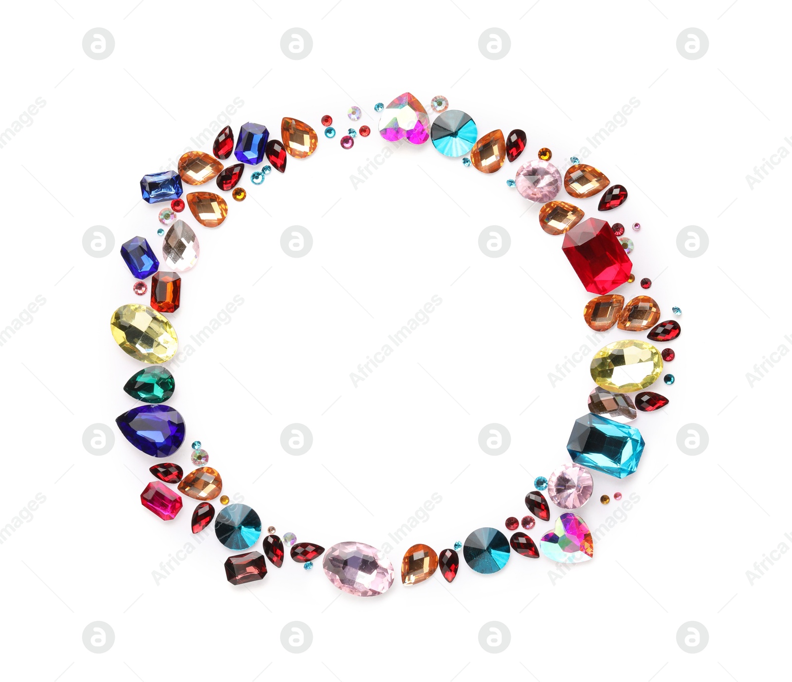 Photo of Frame of different shiny gemstones on white background, flat lay. Space for text