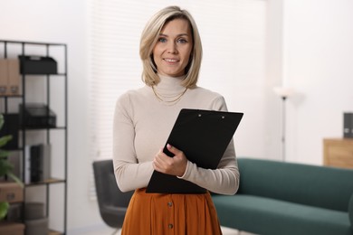 Photo of Portrait of professional psychologist with clipboard in office