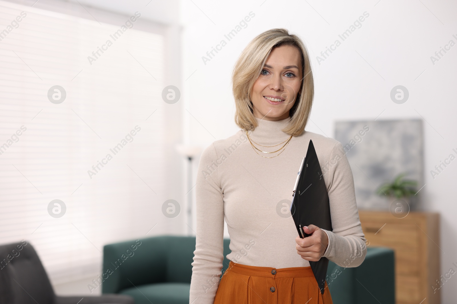 Photo of Portrait of professional psychologist with clipboard in office