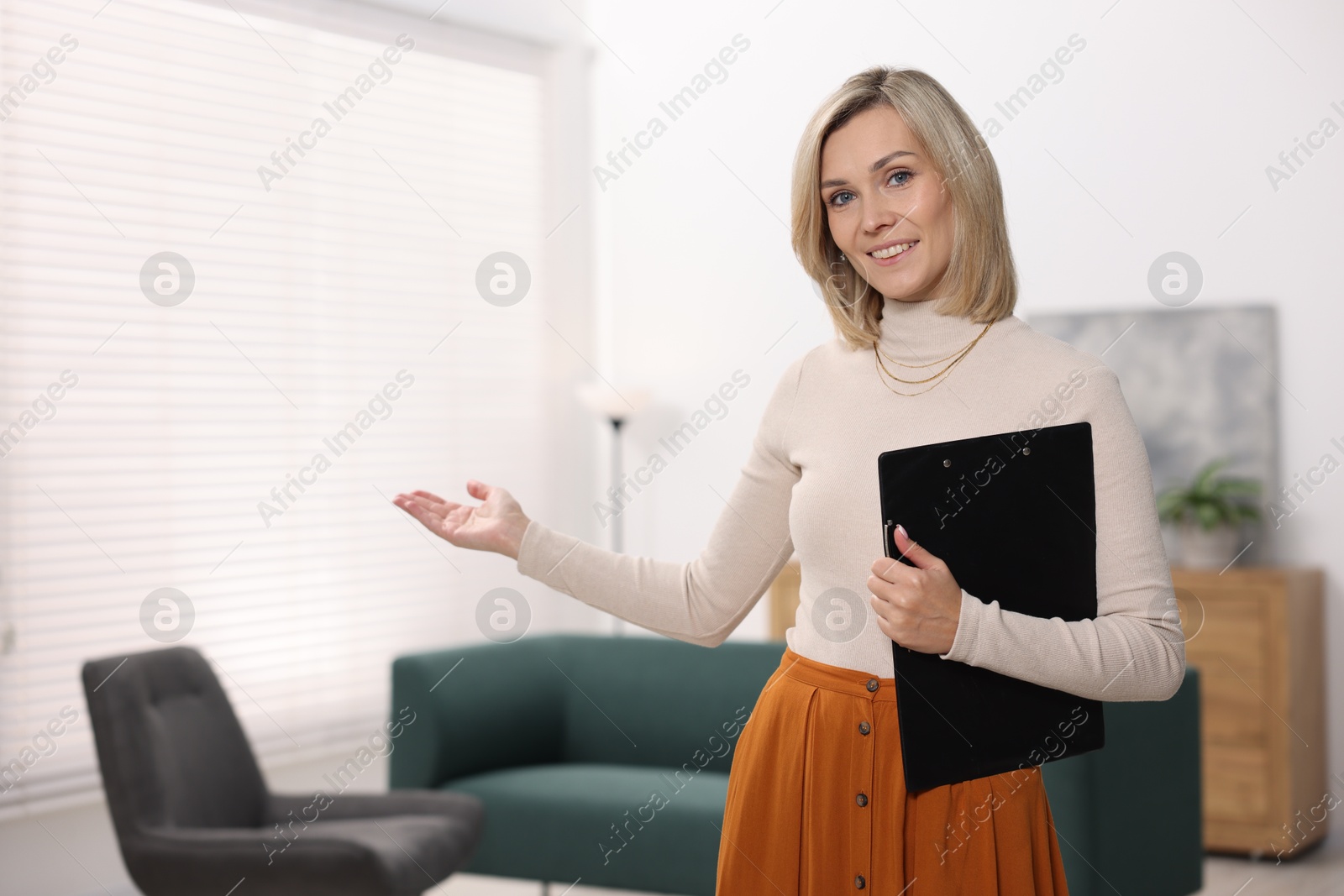 Photo of Portrait of professional psychologist with clipboard in office, space for text