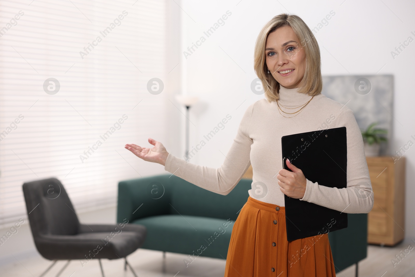 Photo of Portrait of professional psychologist with clipboard in office, space for text