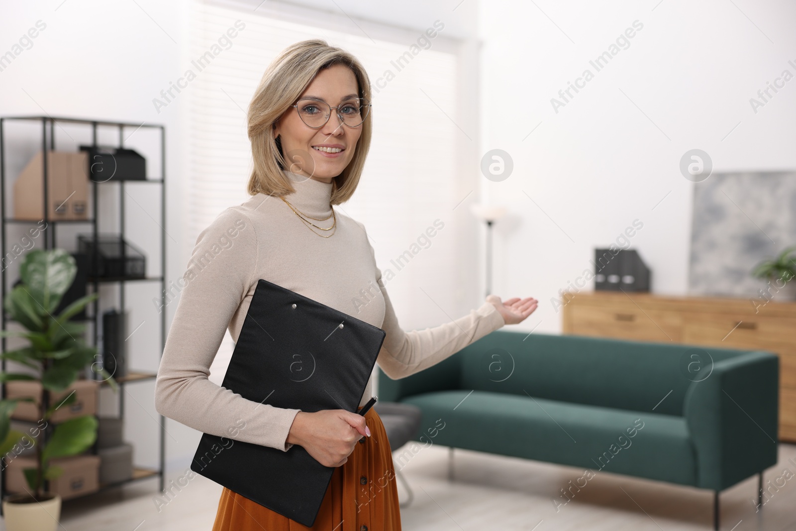 Photo of Portrait of professional psychologist with clipboard in office, space for text