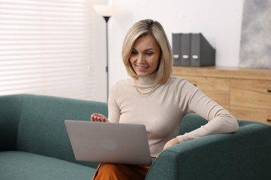 Photo of Professional psychologist working with laptop in office