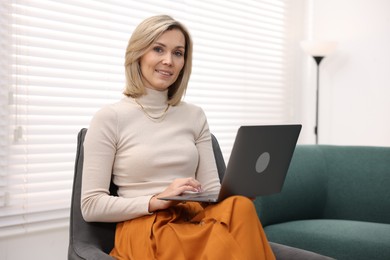 Photo of Professional psychologist working with laptop in office