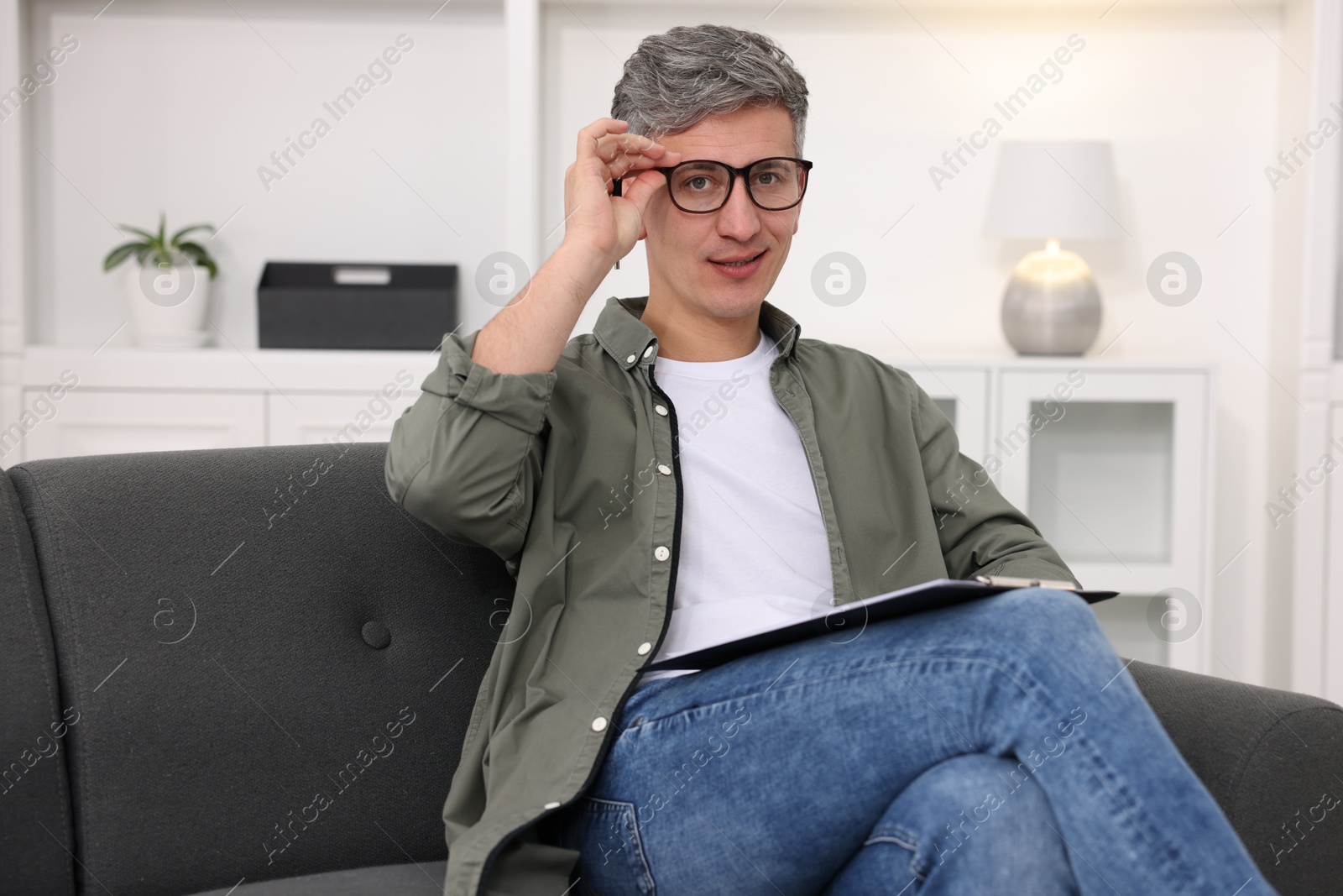 Photo of Portrait of professional psychologist with clipboard in office