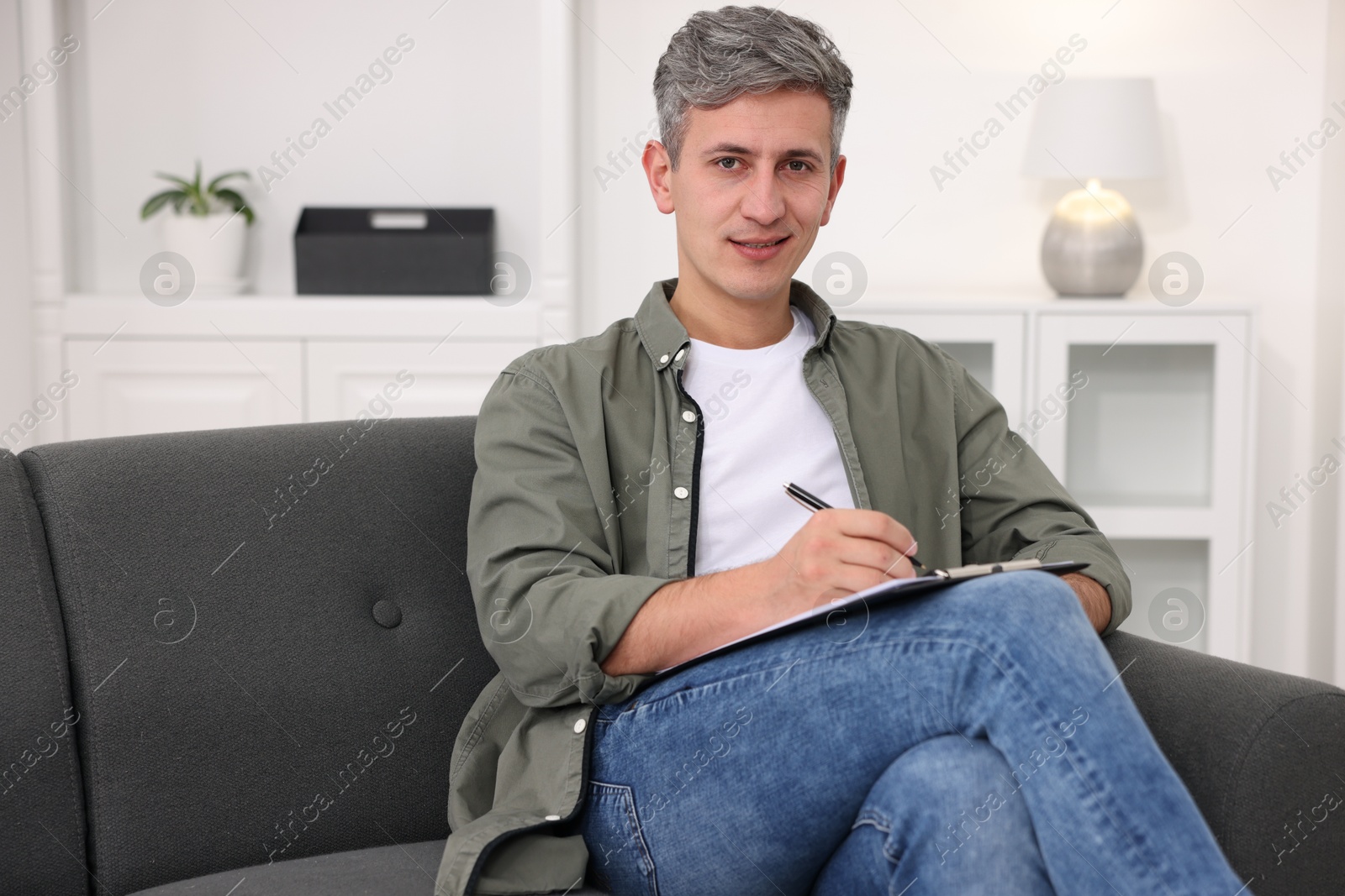 Photo of Portrait of professional psychologist with clipboard in office