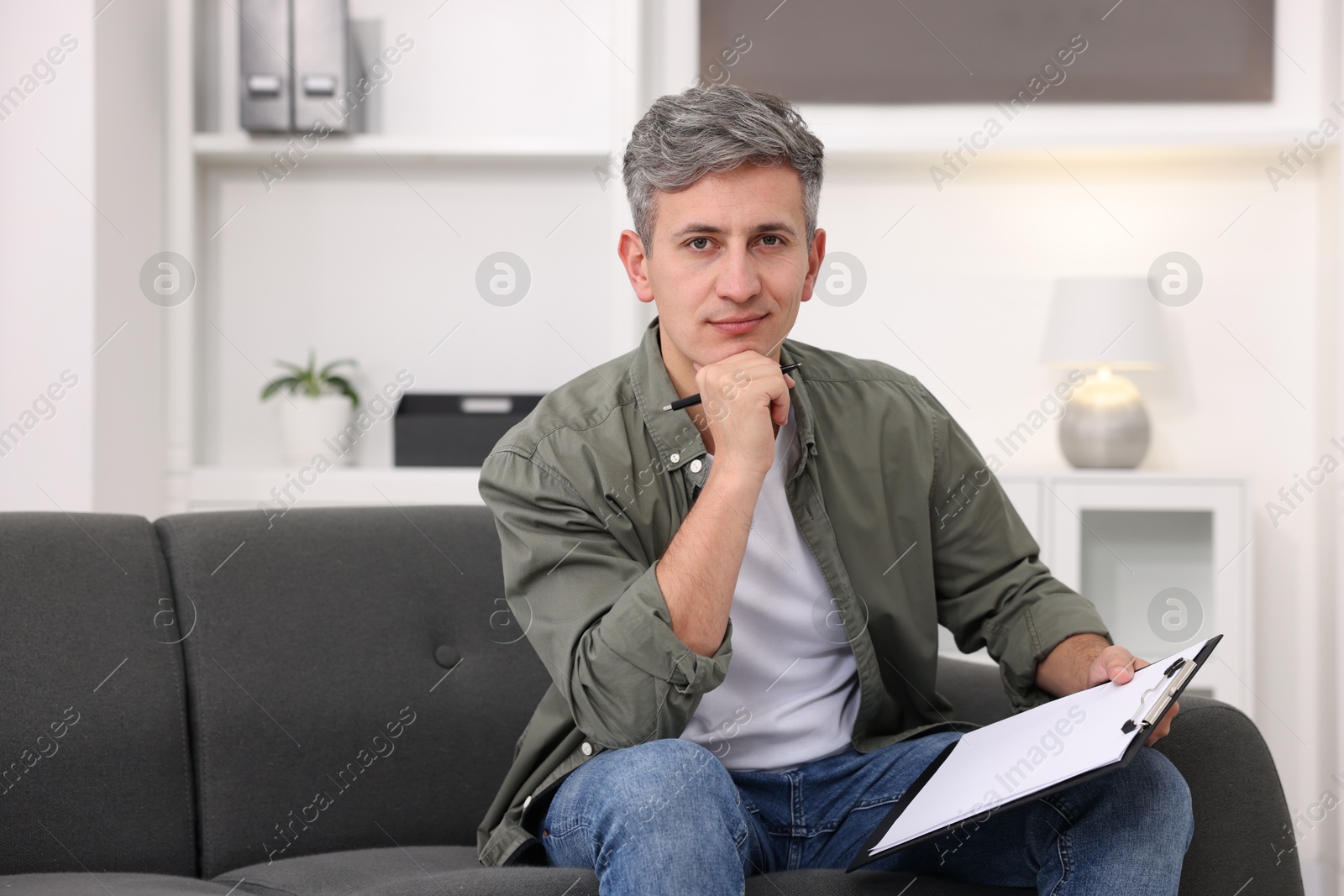 Photo of Portrait of professional psychologist with clipboard in office