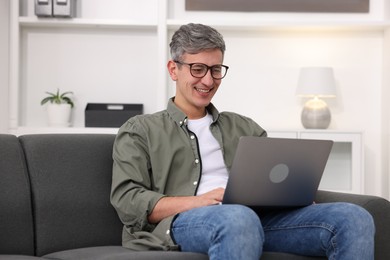 Photo of Professional psychologist working with laptop in office