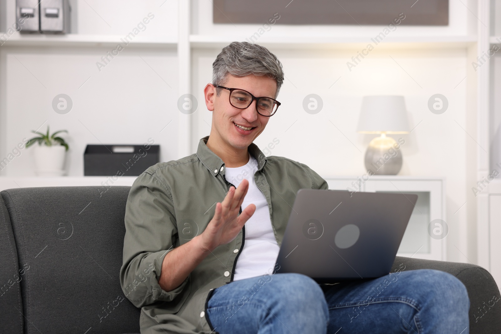 Photo of Professional psychologist working with laptop in office