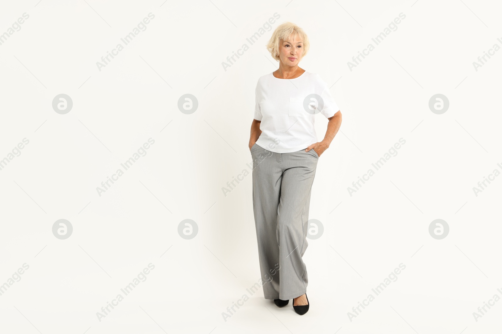 Photo of Full length portrait of beautiful senior woman on white background