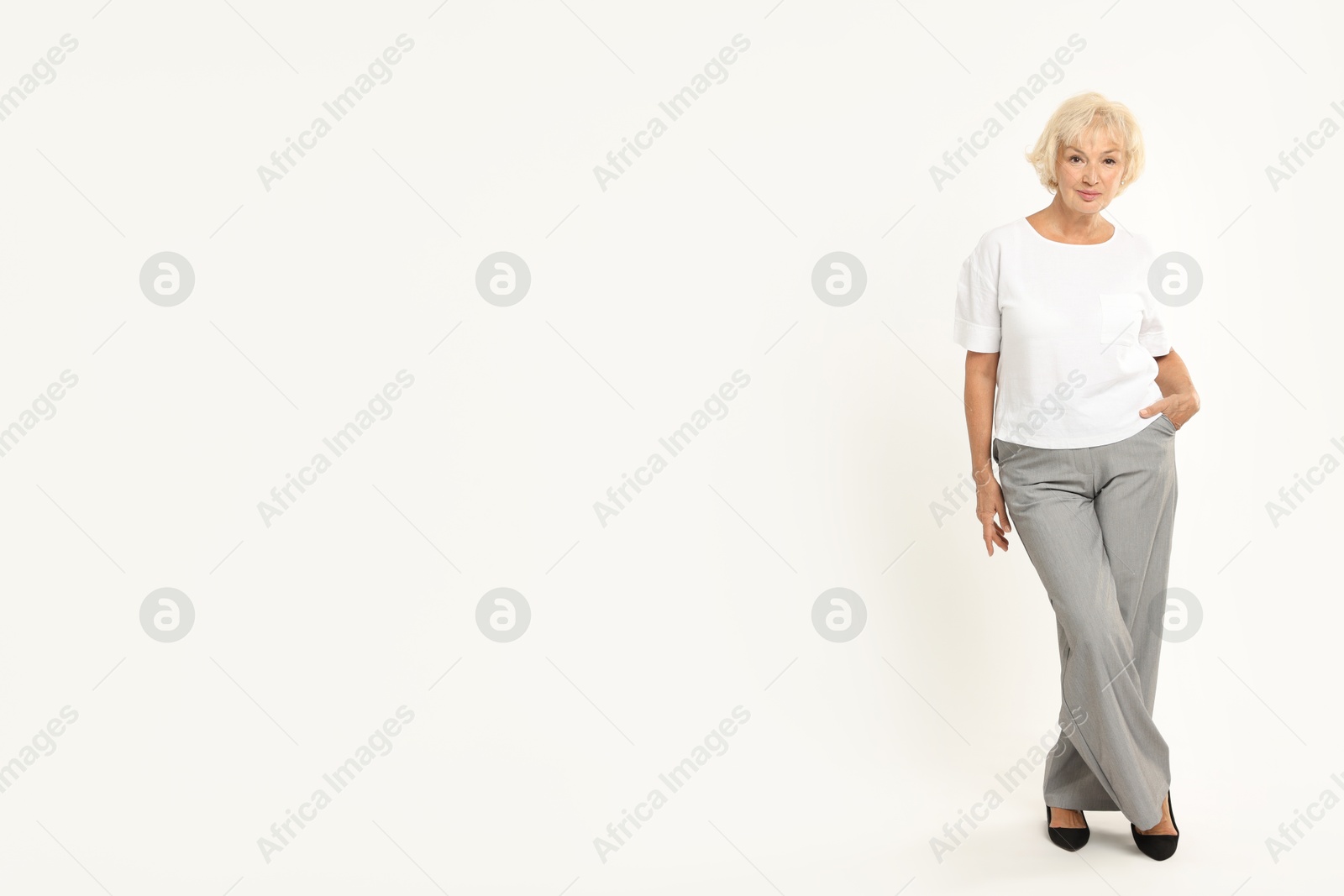 Photo of Full length portrait of beautiful senior woman on white background, space for text