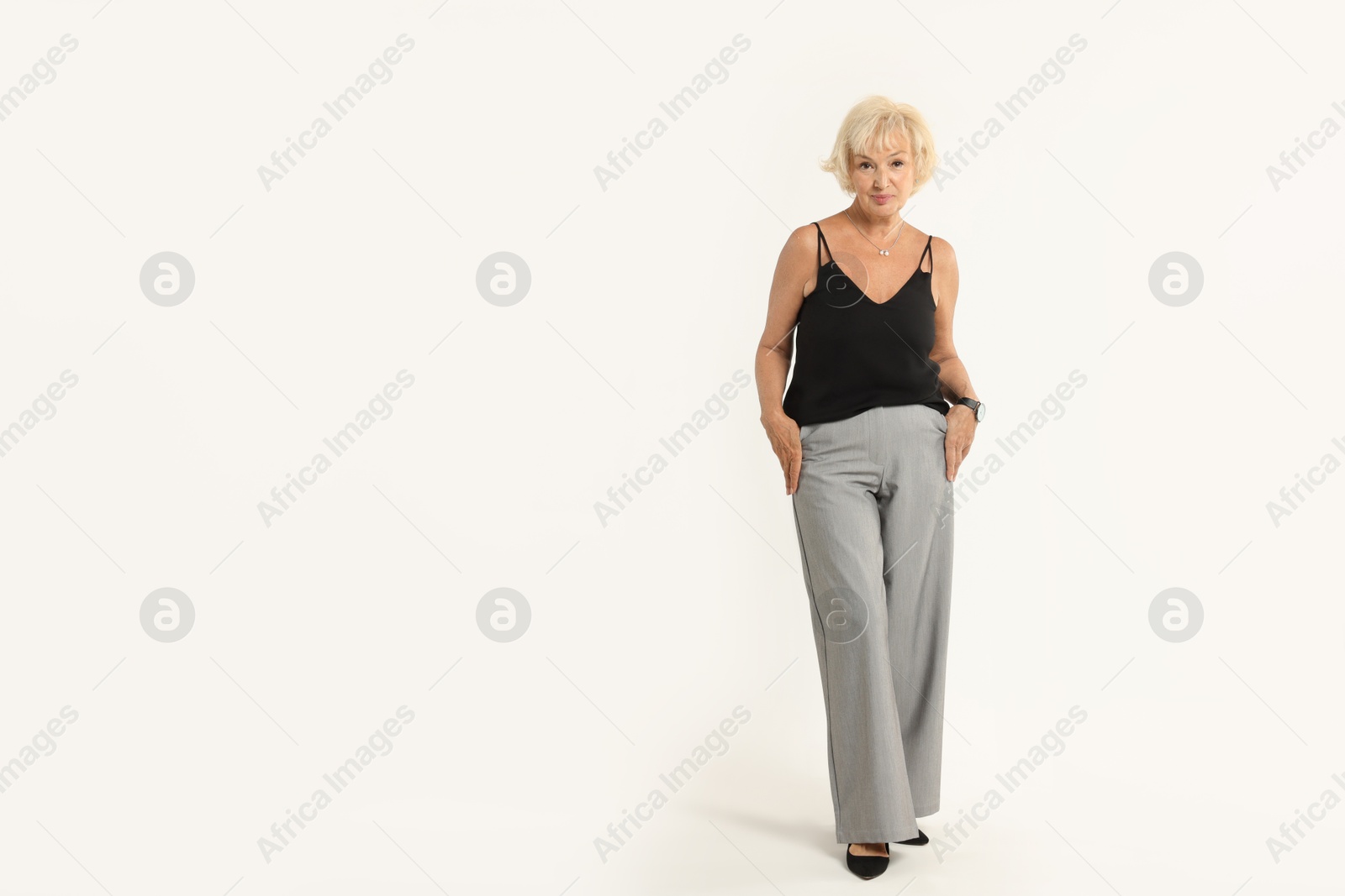 Photo of Full length portrait of beautiful senior woman on white background, space for text