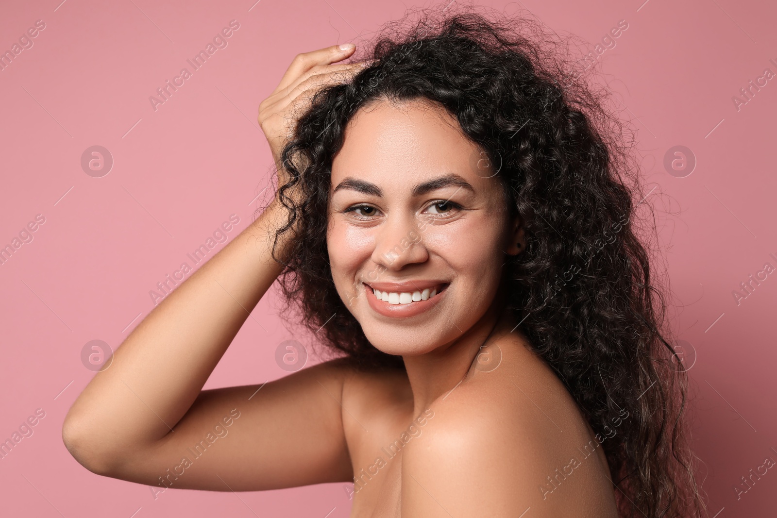 Photo of Cosmetology. Beautiful woman with perfect skin on pink background