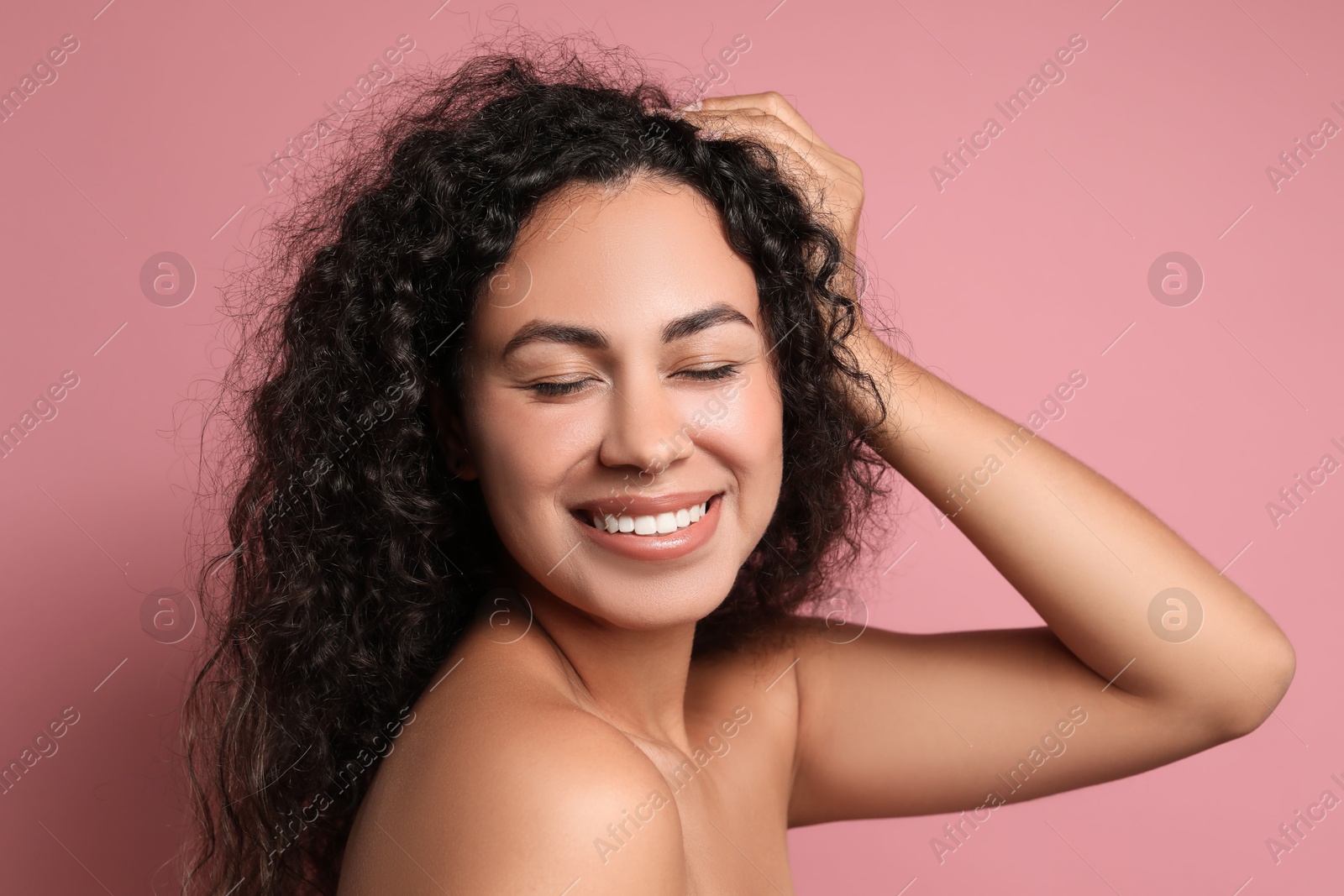 Photo of Cosmetology. Beautiful woman with perfect skin on pink background