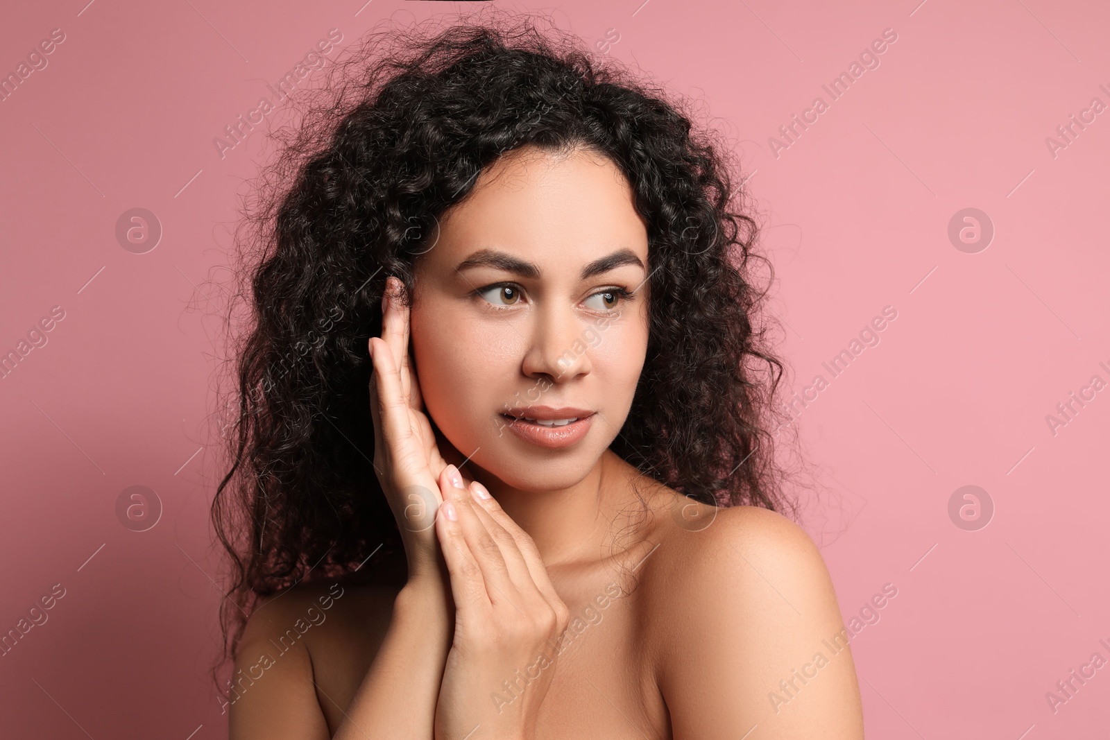 Photo of Cosmetology. Beautiful woman with perfect skin on pink background