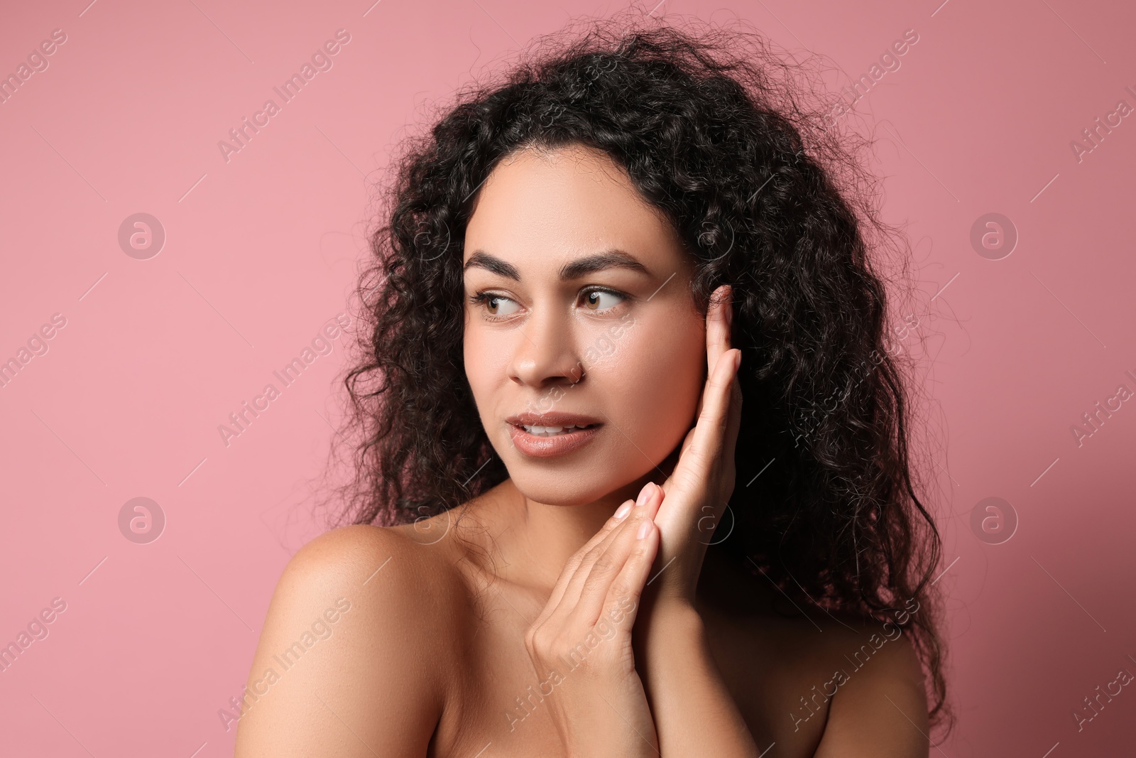 Photo of Cosmetology. Beautiful woman with perfect skin on pink background