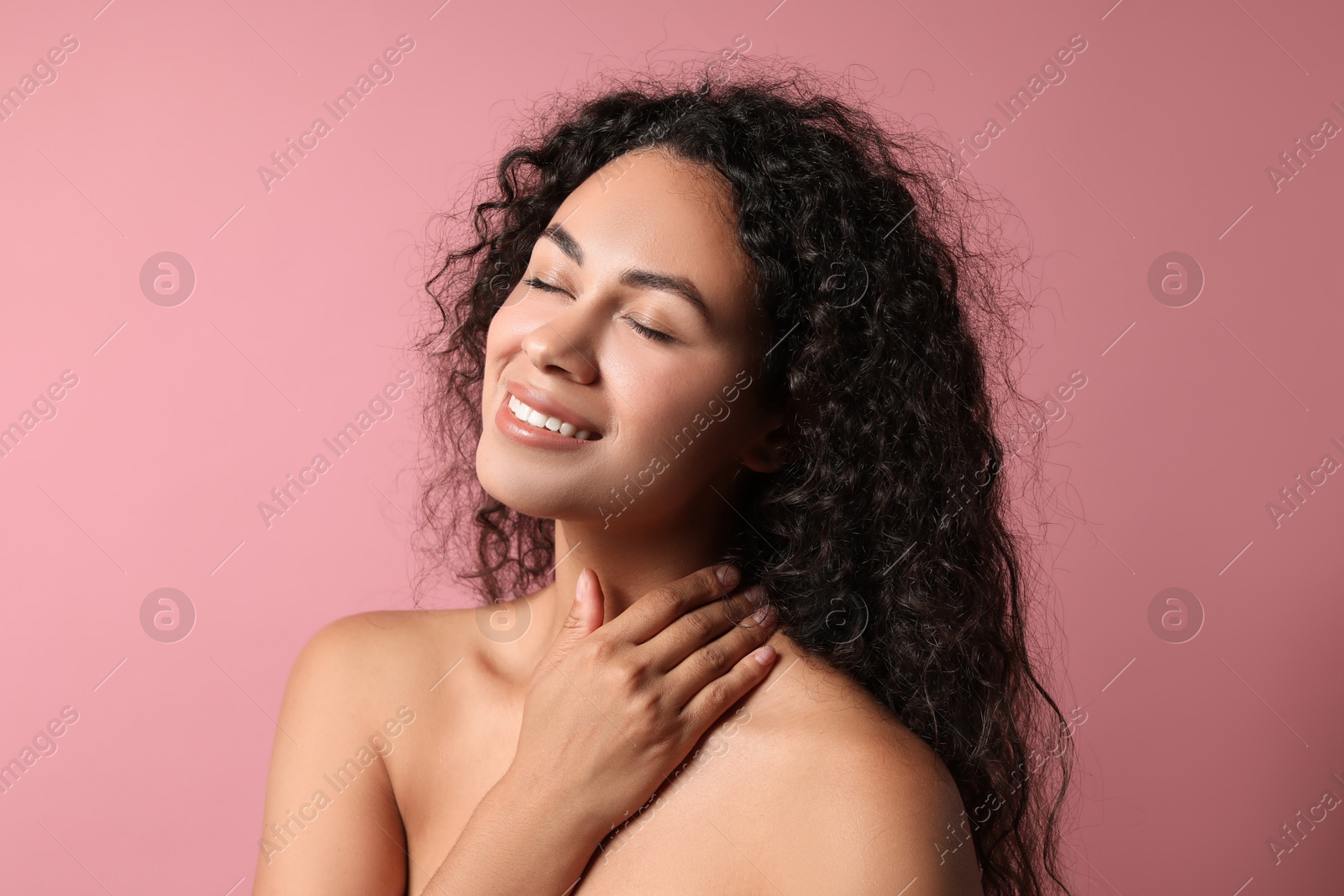 Photo of Cosmetology. Beautiful woman with perfect skin on pink background