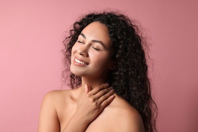 Photo of Cosmetology. Beautiful woman with perfect skin on pink background