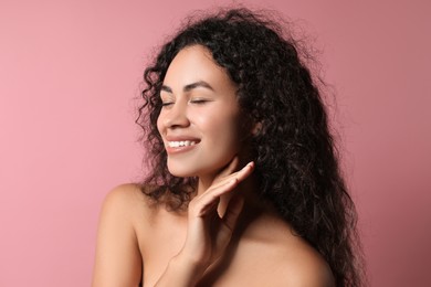 Photo of Cosmetology. Beautiful woman with perfect skin on pink background