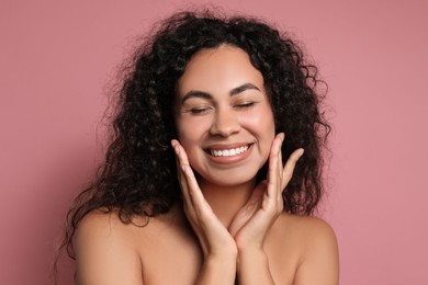 Photo of Cosmetology. Beautiful woman with perfect skin on pink background