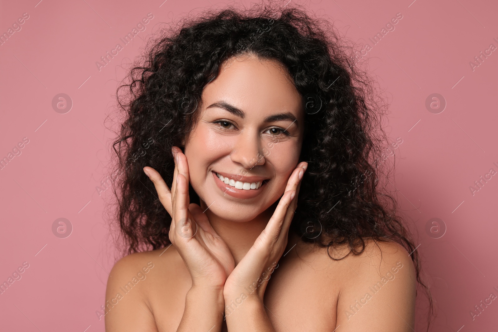 Photo of Cosmetology. Beautiful woman with perfect skin on pink background