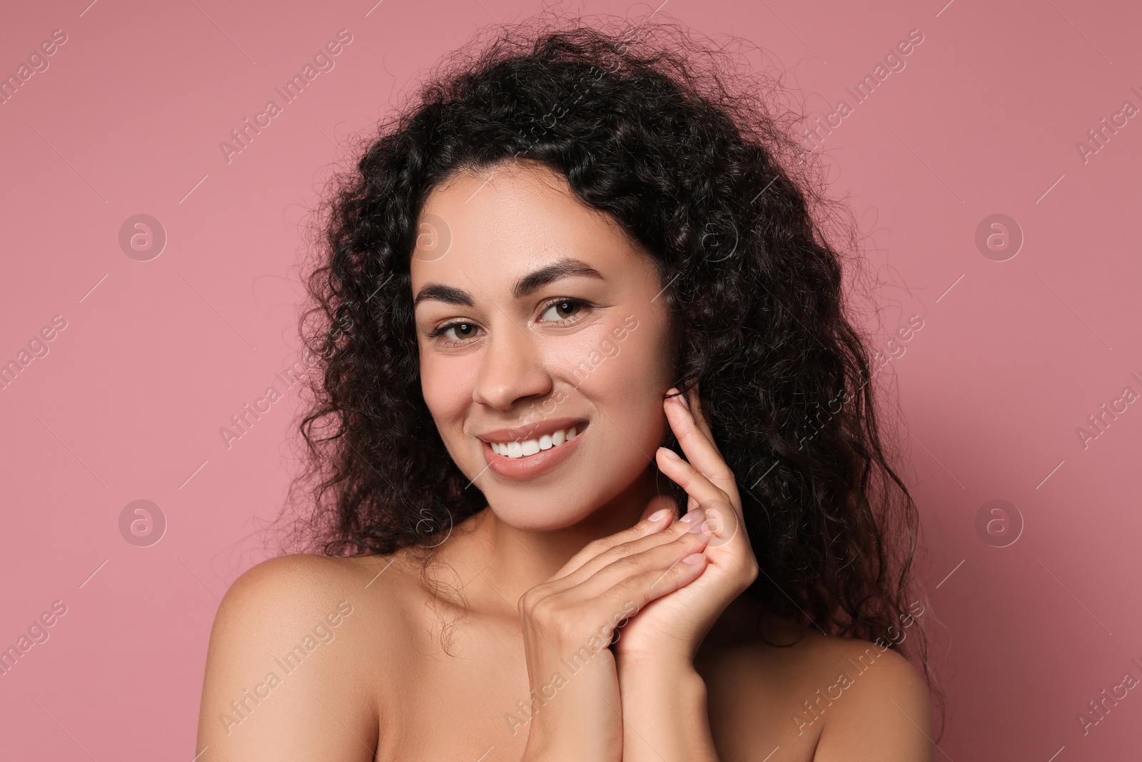 Photo of Cosmetology. Beautiful woman with perfect skin on pink background