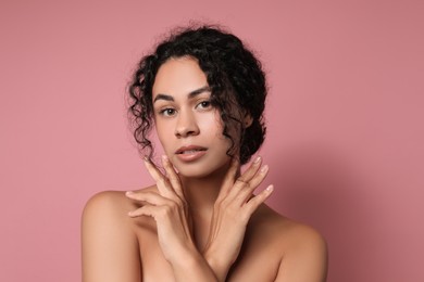 Photo of Cosmetology. Beautiful woman with perfect skin on pink background