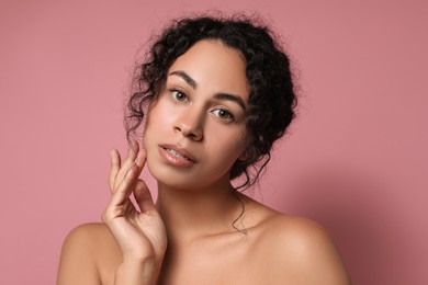 Photo of Cosmetology. Beautiful woman with perfect skin on pink background