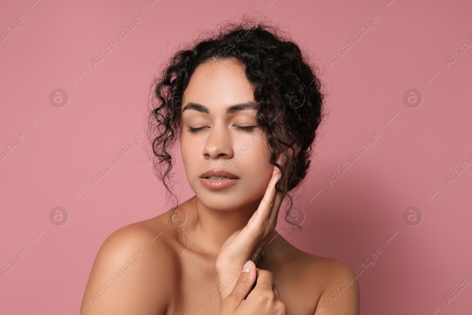 Photo of Cosmetology. Beautiful woman with perfect skin on pink background