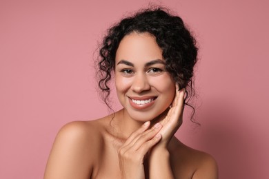 Photo of Cosmetology. Beautiful woman with perfect skin on pink background